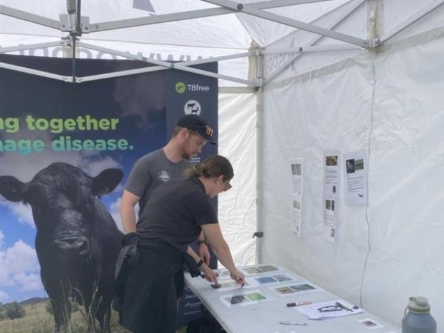 An OSPRI Regional Partner talking to a Young Farmers contestant