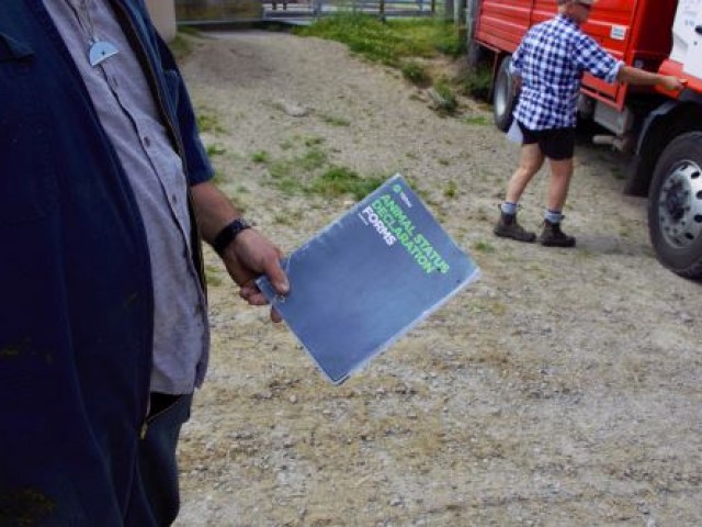 A man holding up an ASD book